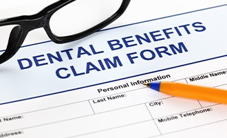 Dental insurance claims form on a table
